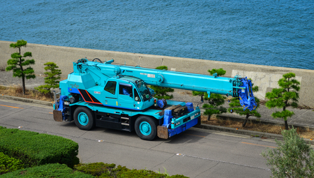 Okayama, Japan - Oct 5, 2017. A crane truck parking at seaside park in Okayama, Japan.のeditorial素材