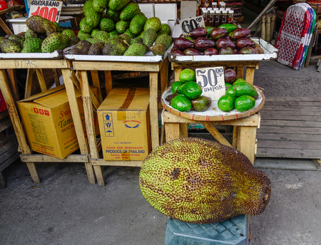 Manila, Philippines - Apr 12, 2017. Selling fruits at market in Manila, Philippines. Manila is the capital of the Philippines and the center of governance, education and finance.のeditorial素材