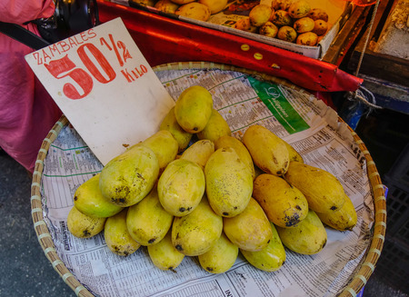 Manila, Philippines - Apr 12, 2017. Selling yellow mangoes on street in Manila, Philippines. Manila is the capital of Philippines and the center of governance, education and finance.のeditorial素材