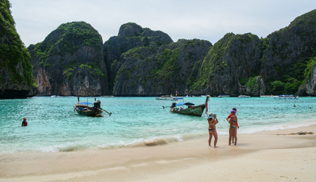 Phuket, Thailand - Jun 19, 2016. People enjoy on Phi Phi beach of Phuket, Thailand. Phuket consists of the island of Phuket, and another 32 smaller islands off its coast.のeditorial素材