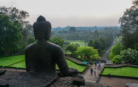 A Buddha statue of Borobudur Temple in Java Island, Indonesia. Borobudur is one of world truly great ancient monuments.の写真素材