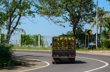 Yogyakarta, Indonesia - Apr 14, 2016. A truck runs on street in Yogyakarta, Indonesia. Yogyakarta (Jogja) is a city on the island of Java known for its traditional arts and cultural heritage.のeditorial素材