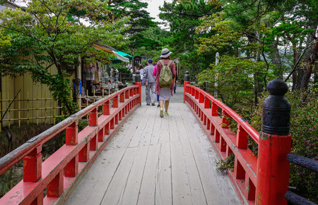 Matsushima, Japan - Sep 27, 2017. Tourists walking on red bridge in Matsushima, Japan. Matsushima has been ranked one of Japan three most scenic views for centuries.のeditorial素材