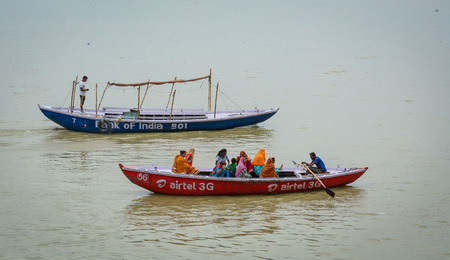 Varanasi, India - Jul 12, 2015. Tourist boats running on Ganges River in Varanasi, India. Varanasi...