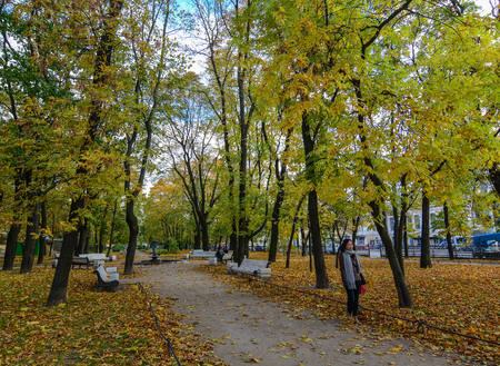 St Petersburg, Russia - Oct 7, 2016. People walking at the autumn park in Saint Petersburg, Russia. Saint Petersburg has a significant historical and cultural heritage.のeditorial素材