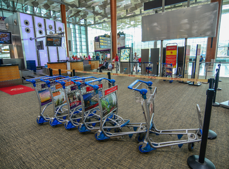 Singapore - Mar 14, 2016. Trolleys at Departure Terminal of Singapore Changi Airport. The Airport serves more than 100 airlines flying to 380 cities in around 90 countries.のeditorial素材