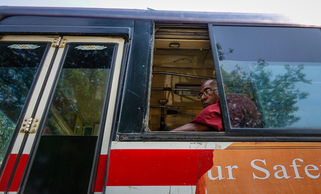 Yangon, Myanmar - Feb 27, 2016. A monk sitting on local bus in Yangon, Myanmar. Yangon (formerly known as Rangoon) is the largest city in Myanmar (formerly Burma).のeditorial素材