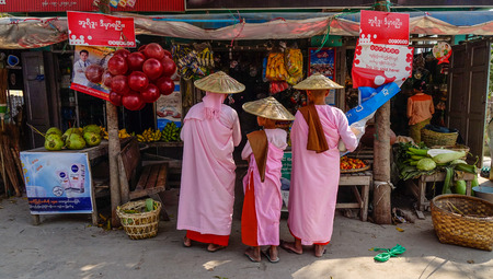 Yangon, Myanmar - Feb 21, 2016. Buddhist nuns on street in Yangon, Myanmar. Yangon, also called Rangoon, city, capital of independent Myanmar from 1948 to 2006.のeditorial素材
