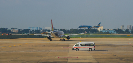 Phu Quoc, Vietnam - Dec 6, 2017. Vehicles on runway of Phu Quoc International Airport. Phu Quoc is a...