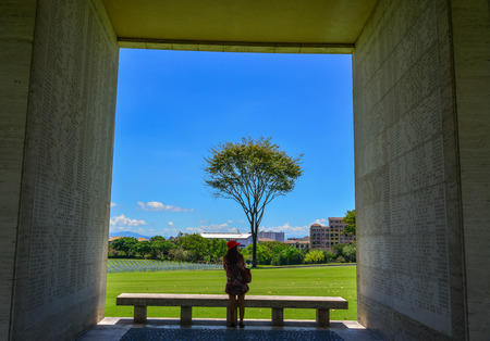 Manila, Philippines - Apr 13, 2017. A woman standing at the Manila American Cemetery. Cemetery honors the American and allied servicemen who died in World War II.のeditorial素材
