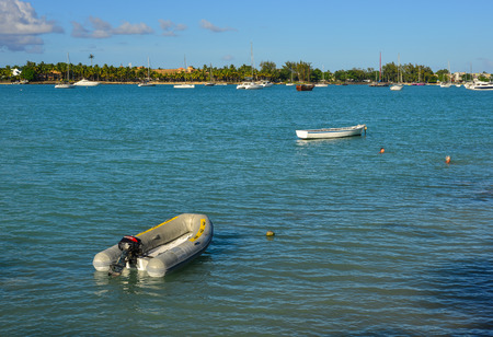Grand Baie, Mauritius - Jan 9, 2017. Small boats on beautiful sea in Grand Baie, Mauritius Island....