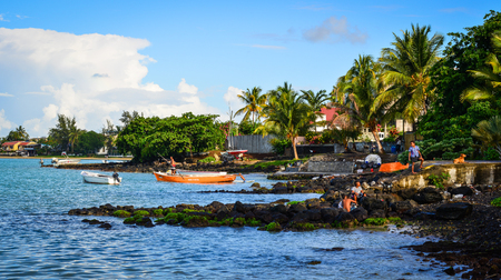 Grand Baie, Mauritius - Jan 9, 2017. People on beach in Grand Baie, Mauritius. Mauritius, an Indian Ocean island nation, is known for its beaches, lagoons and reefs.のeditorial素材