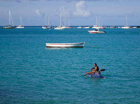 Mahebourg, Mauritius - Jan 9, 2017. A man fishing on sea in Mahebourg, Mauritius. Mauritius is a major tourist destination, ranking 3rd in the region.のeditorial素材