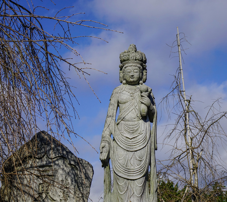 Buddha sculpture at the Japanese garden in Kyoto, Japan.
