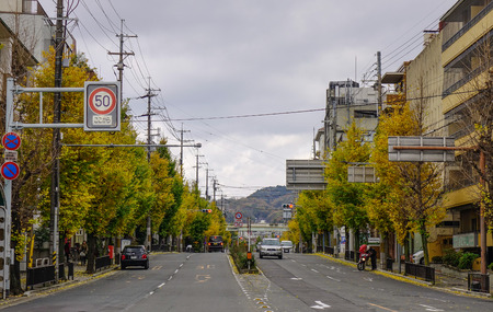 Kyoto, Japan - Nov 28, 2016. Vehicles on street at autumn in Kyoto, Japan. Kyoto was the capital of Japan for over a millennium, and carries a reputation as its most beautiful city.のeditorial素材