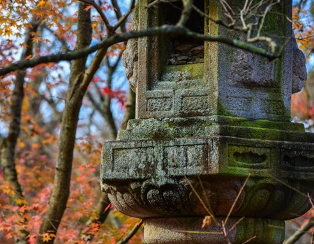 Ancient stone lantern at the autumn park in Kyoto, Japan.の写真素材