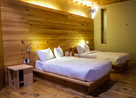 Thimphu, Bhutan - Aug 30, 2015. Wooden bedroom of luxury hotel in Thimphu, Bhutan. Bhutan is...