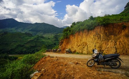 Ha Giang, Vietnam - Sep 27, 2016. A motorbike parking on mountain road at summer day in Ha Giang, Northern Vietnam.のeditorial素材