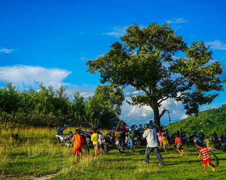 Daklak, Vietnam - Oct 10, 2015. Children playing on grass field at small village in Daklak Province, Central Highlands of Vietnam.のeditorial素材