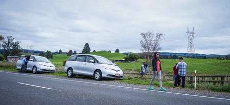 Auckland, New Zealand - Apr 25, 2015. Cars parking on rural road in Auckland, New Zealand. Auckland is a major city in the north of New Zealand North Island.のeditorial素材