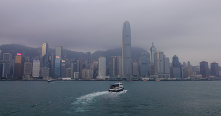 Hong Kong - Mar 29, 2017. A ferry running on Victoria Harbour at misty day in Hong Kong.
