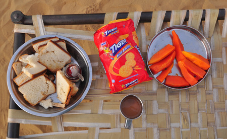 Jaisalmer, India - Mar 4, 2012. A simple breakfast with bread, snack and fruits during camel safari in Jaisalmer, India.のeditorial素材