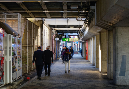 Tokyo, Japan - Jan 4, 2016. People walking on walkway tunnel at Shibuya District in Tokyo, Japan.のeditorial素材