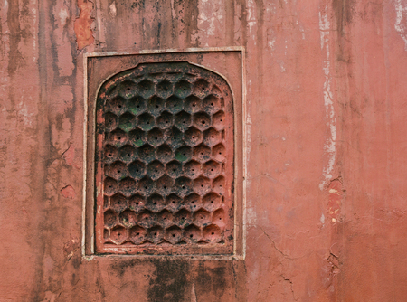 Red sand stone texture pattern on surface of the wall of ancient palace in Jaipur, India.の写真素材