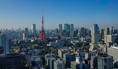 Tokyo, Japan - Jan 4, 2016. Red Tower with cityscape in Tokyo, Japan. Tokyo has the largest metropolitan economy in the world.のeditorial素材