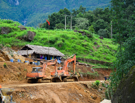 Sa Pa, Vietnam - May 31, 2016. Excavators working on road construction in Sa Pa, Vietnam. Sa Pa is a mountain town in Lao Cai, northwestern Vietnam.のeditorial素材