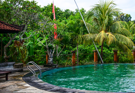 Bali, Indonesia - Apr 22, 2016. Swimming pool of resort in Bali, Indonesia. Bali is a popular tourist destination which has seen a significant rise since the 1980s.のeditorial素材