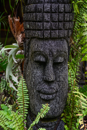 A Buddha statue at green garden in Bali Island, Indonesia.の写真素材