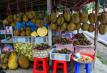 Bali, Indonesia - Apr 20, 2016. Selling tropical fruits in Bali, Indonesia. Bali is a popular tourist destination which has seen a significant rise since the 1980s.のeditorial素材