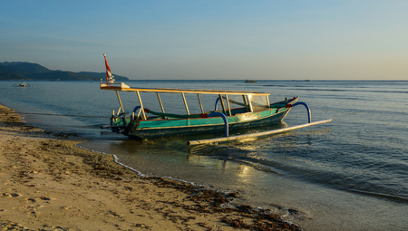 Lombok, Indonesia - Apr 17, 2016. A wooden boat waiting on sea in Lombok, Indonesia. Lombok, an island next to Bali where the tourism is still in its infancy.のeditorial素材