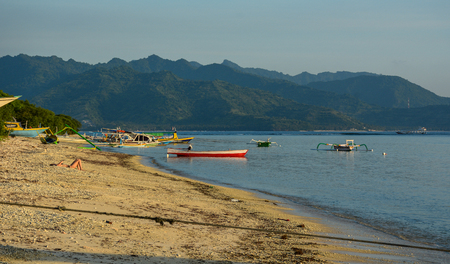Lombok, Indonesia - Apr 17, 2016. Wooden boats wait on sea in Lombok, Indonesia. Lombok Island is the highlight holiday destination of Indonesia.のeditorial素材