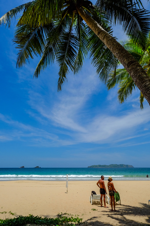 Palawan, Philippines - Apr 6, 2017. Tourists enjoying on sand beach at summer day in Palawan Island. Palawan is one of the most beautiful islands in the world.のeditorial素材