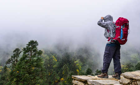 A trekker standing and enjoying mountain view in Khopra, Nepal.の写真素材