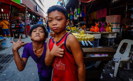 Manila, Philippines - Apr 12, 2017. Children playing at street market in Manila, Philippines.のeditorial素材