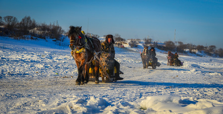 Mohe, China - Feb 20, 2017. Horse carts running on ice river in Mohe County, Heilongjiang Province, China.のeditorial素材