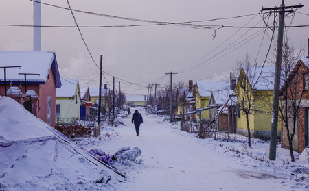 Mohe, China - Feb 19, 2017. People walking on rural road at winter in Mohe County, Heilongjiang Province, China.のeditorial素材