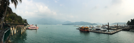 Nantou, Taiwan - Mar 16, 2015. Tourist jetty on Sun Moon Lake at sunny day. Sun Moon Lake is in the foothills of Taiwan Central Mountain Range.のeditorial素材