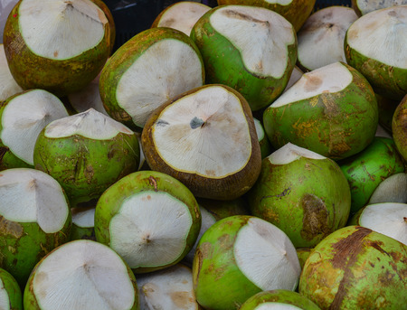 Coconut fruits for sale at market in Chinatown, Singapore.の写真素材