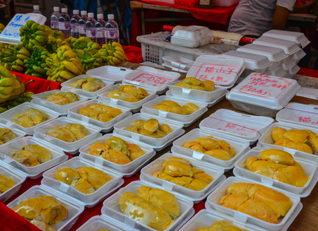 Singapore - Feb 9, 2018. Selling durian fruits at street market in Chinatown, Singapore.のeditorial素材