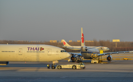 Beijing, China - Mar 1, 2018. Civil aircrafts on runway at Terminal 3 of Beijing Capital Airport (PEK), China.のeditorial素材