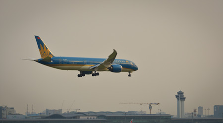 Saigon, Vietnam - Mar 11, 2018. A Boeing 787-8 aircarft of Vietnam Airlines is landing at Tan Son...