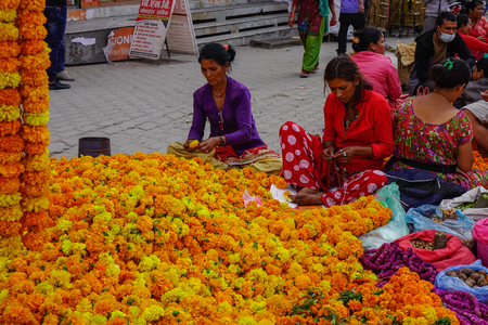 Kathmandu, Nepal - Oct 17, 2017. Vendors sell flowers on Durbar Square in Kathmandu, Nepal. Several buildings in the Square collapsed due to a major earthquake.のeditorial素材