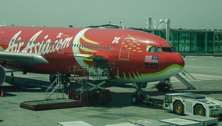 Kuala Lumpur, Malaysia - Oct 17, 2017. An AirAsia X Airbus A330 (Xcintillating PhoeniX Livery) docking at Kuala Lumpur International Airport (KLIA2).のeditorial素材