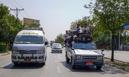 Mandalay, Myanmar - Feb 11, 2017. Cars running on street at downtown in Mandalay, Myanmar.のeditorial素材