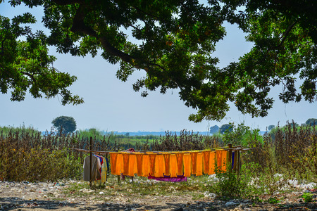 Drying colorful fabric after traditional dye process shot at the village in Mandalay, Myanmar.の写真素材