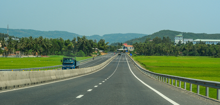 Nha Trang, Vietnam - Mar 21, 2016. Vehicles run on National Route 1A in Nha Trang, Vietnam. The total length of the Viet Nam road system is about 222,179 km.のeditorial素材